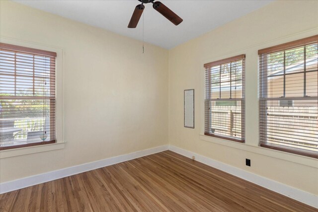 1905 Mckinley St, Clearwater, FL 33765 - unfurnished room with ceiling fan, baseboards, and wood finished floors