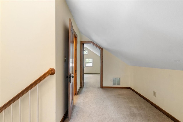 1905 Mckinley St, Clearwater, FL 33765 - bonus room featuring baseboards, vaulted ceiling, visible vents, and light colored carpet
