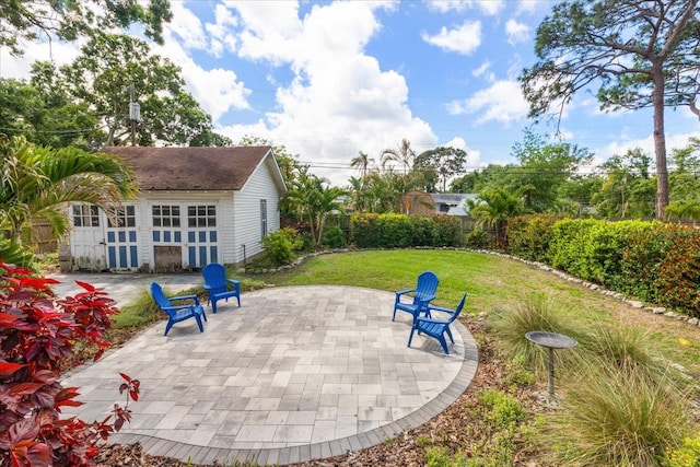 1905 Mckinley St, Clearwater, FL 33765 - view of patio with fence, an outbuilding, and a garage