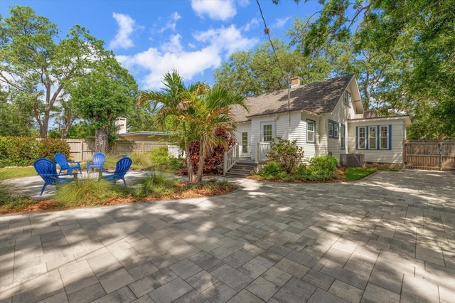 1905 Mckinley St, Clearwater, FL 33765 - rear view of property with central air condition unit, crawl space, a patio, and fence