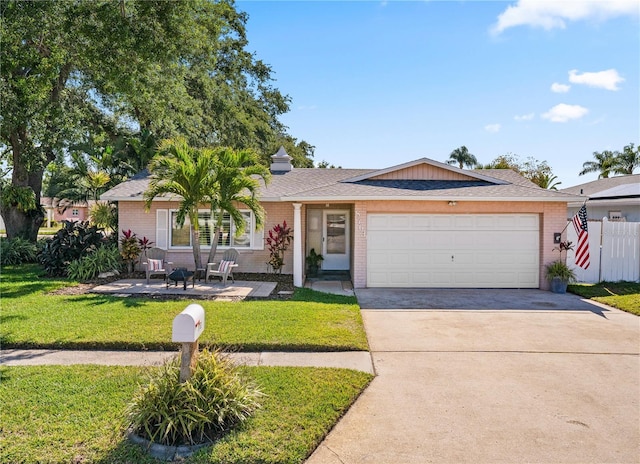 8763 Matthew St, Seminole, FL 33772 - single story home featuring brick siding, a front lawn, an attached garage, and concrete driveway