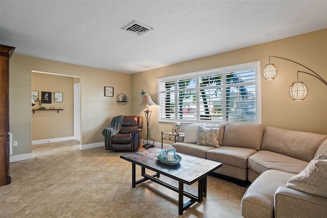 8763 Matthew St, Seminole, FL 33772 - living room with baseboards and visible vents