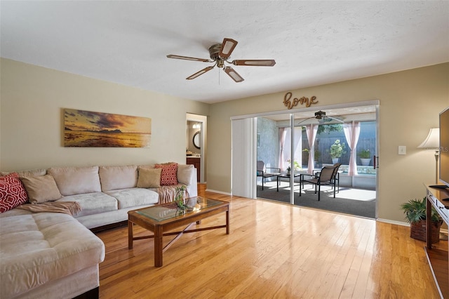 8763 Matthew St, Seminole, FL 33772 - living room with baseboards, a ceiling fan, and hardwood / wood-style floors