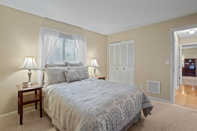8763 Matthew St, Seminole, FL 33772 - bedroom with a closet, light colored carpet, baseboards, and visible vents