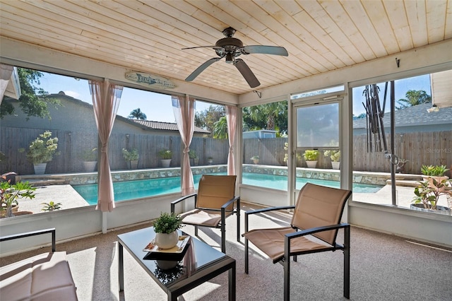8763 Matthew St, Seminole, FL 33772 - sunroom with wood ceiling, a healthy amount of sunlight, and carpet flooring