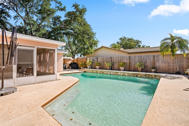 8763 Matthew St, Seminole, FL 33772 - view of pool with a patio area, a fenced backyard, a fenced in pool, and a sunroom