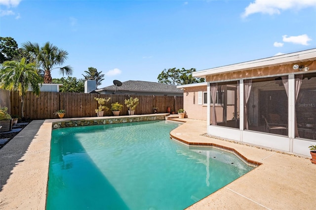 8763 Matthew St, Seminole, FL 33772 - view of swimming pool with a fenced in pool, a patio, a fenced backyard, and a sunroom
