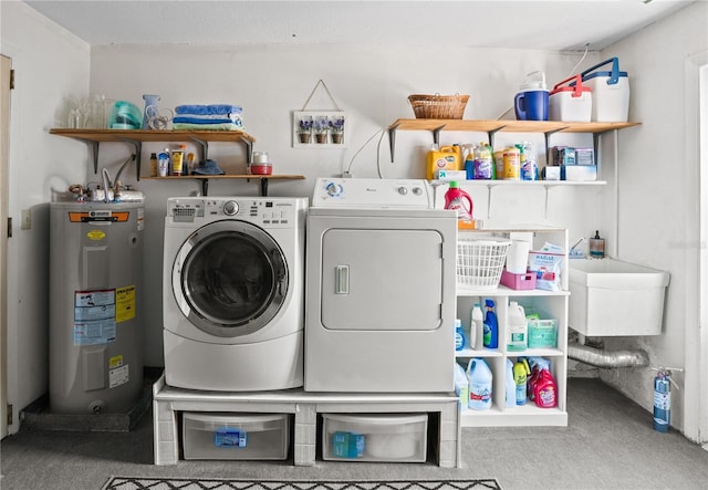 8763 Matthew St, Seminole, FL 33772 - clothes washing area featuring electric water heater, washing machine and clothes dryer, carpet, and laundry area