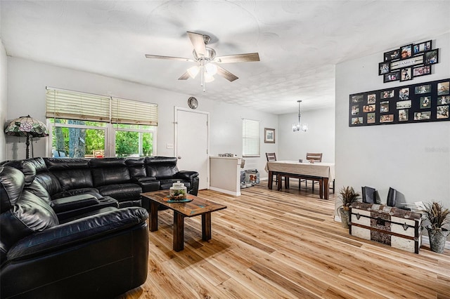 186 Grand Ave, Brooksville, FL 34604 - living room featuring ceiling fan, light wood finished floors, and a chandelier