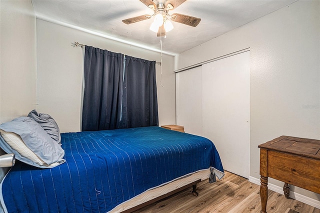 186 Grand Ave, Brooksville, FL 34604 - bedroom with wood finished floors, ceiling fan, a closet, and baseboards