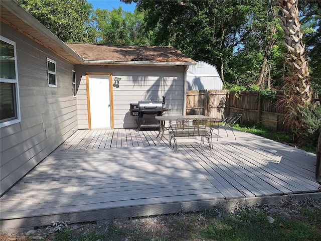 186 Grand Ave, Brooksville, FL 34604 - wooden deck featuring fence, outdoor dining space, and area for grilling