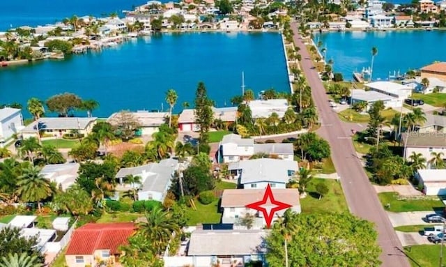 birds eye view of property featuring a water view and a residential view