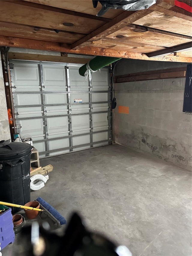 garage with concrete block wall