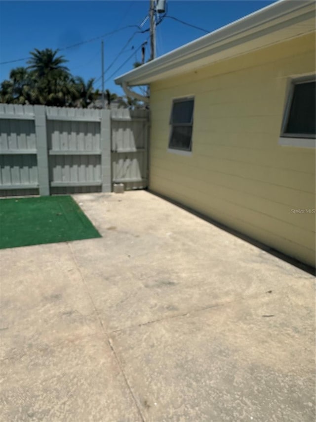 view of patio / terrace with fence and a gate