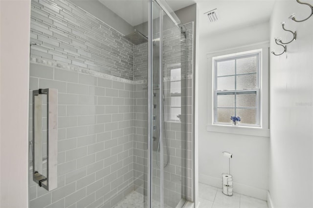 2704 W Main St, Tampa, FL 33607 - bathroom featuring a shower stall, visible vents, tile patterned floors, and baseboards