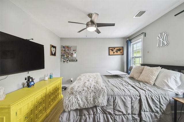 2704 W Main St, Tampa, FL 33607 - bedroom featuring wood finished floors, visible vents, and ceiling fan