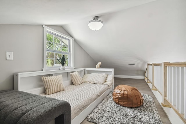 2704 W Main St, Tampa, FL 33607 - bedroom with wood finished floors and lofted ceiling