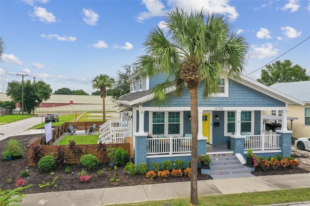 2704 W Main St, Tampa, FL 33607 - bungalow-style house with fence and covered porch