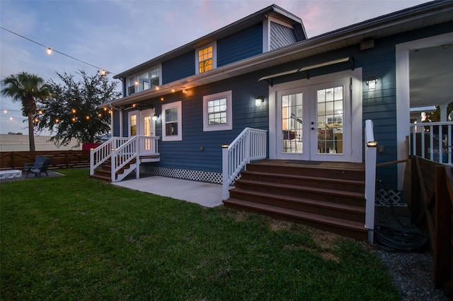2704 W Main St, Tampa, FL 33607 - exterior space with fence, a patio area, french doors, a lawn, and an outdoor fire pit