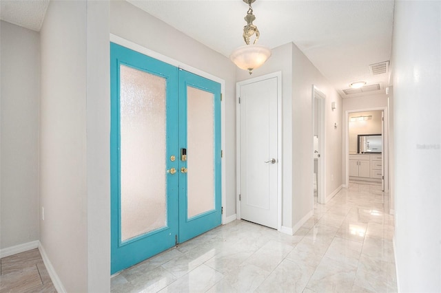 4120 Marine Pkwy, New Port Richey, FL 34652 - foyer entrance featuring marble finish floor, french doors, baseboards, and visible vents
