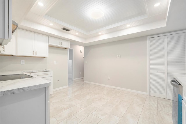 4120 Marine Pkwy, New Port Richey, FL 34652 - kitchen featuring white cabinets, recessed lighting, light stone counters, and a raised ceiling