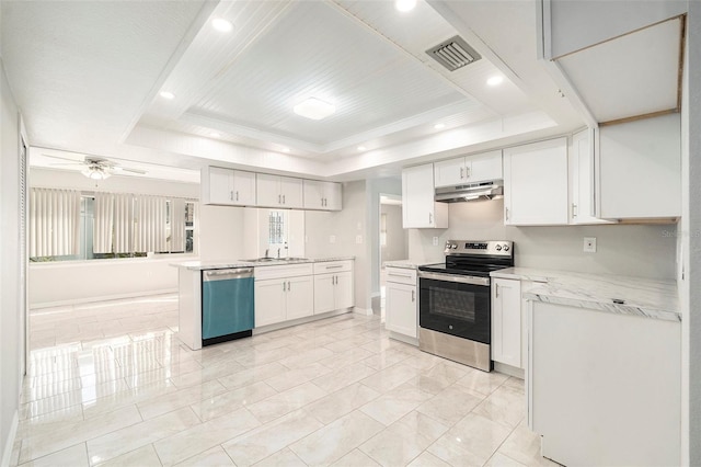 4120 Marine Pkwy, New Port Richey, FL 34652 - kitchen with white cabinetry, under cabinet range hood, visible vents, a raised ceiling, and appliances with stainless steel finishes