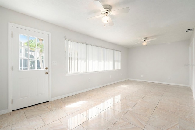 4120 Marine Pkwy, New Port Richey, FL 34652 - interior space featuring visible vents, baseboards, and a ceiling fan