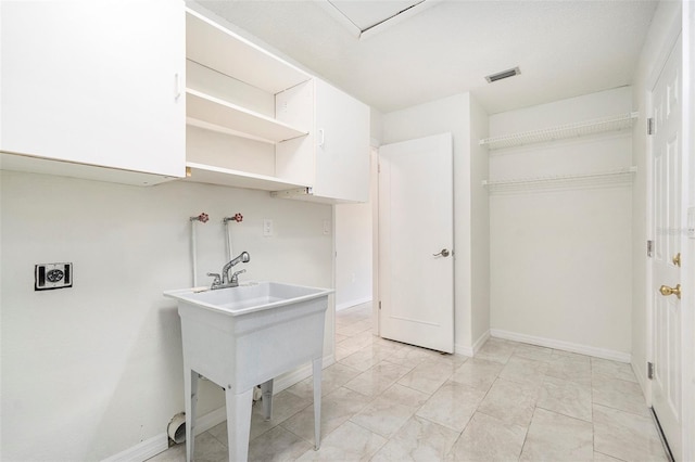 4120 Marine Pkwy, New Port Richey, FL 34652 - laundry room with visible vents, baseboards, and washer hookup
