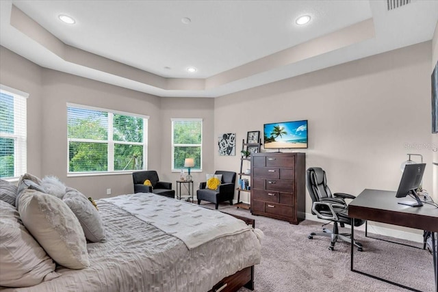 bedroom featuring recessed lighting, multiple windows, and carpet floors