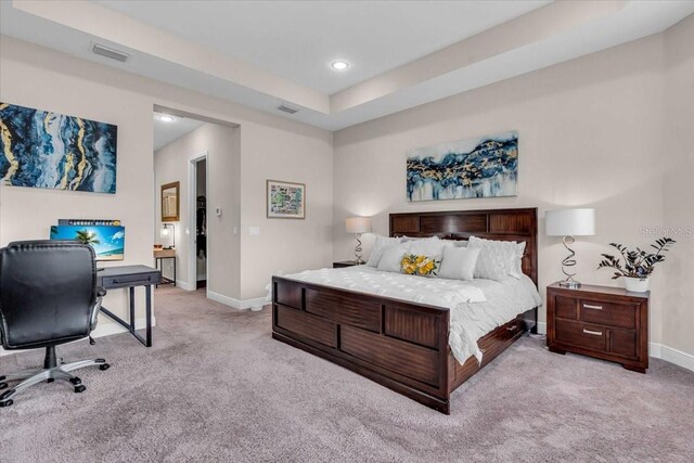 bedroom featuring visible vents, baseboards, and carpet