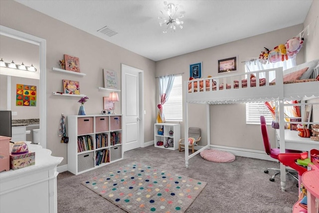 bedroom with baseboards, carpet flooring, a notable chandelier, and visible vents