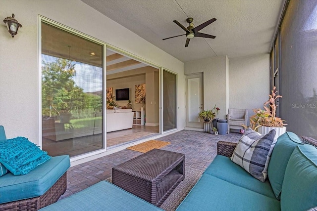 sunroom / solarium with outdoor lounge area and ceiling fan