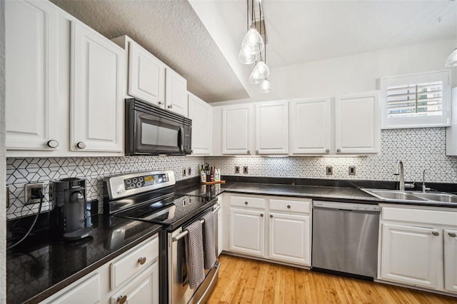 kitchen with white cabinets, a sink, and appliances with stainless steel finishes