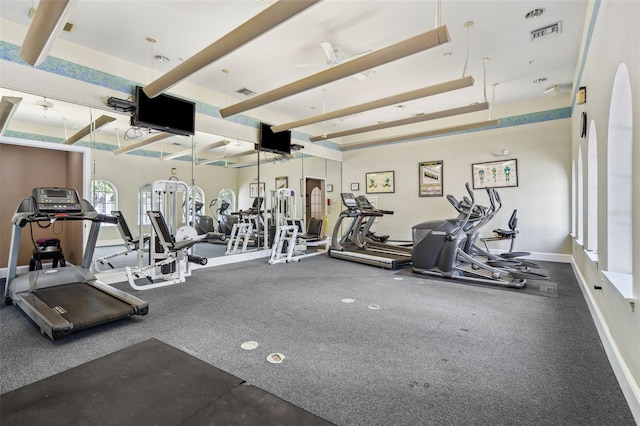 exercise room featuring baseboards and visible vents