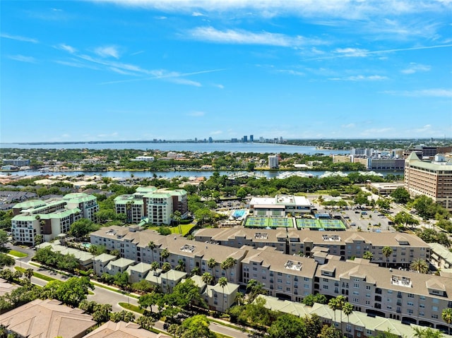 drone / aerial view featuring a city view and a water view