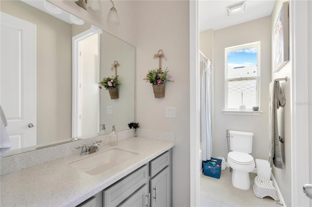2511 Early Dawn Ct, Valrico, FL 33594 - bathroom with tile patterned flooring, visible vents, toilet, vanity, and baseboards