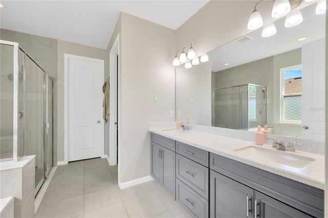 2511 Early Dawn Ct, Valrico, FL 33594 - full bath with tile patterned floors, a sink, a shower stall, and double vanity