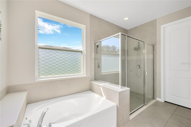 2511 Early Dawn Ct, Valrico, FL 33594 - full bathroom with a shower stall, a garden tub, and tile patterned floors