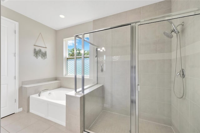 2511 Early Dawn Ct, Valrico, FL 33594 - bathroom featuring tile patterned floors, a garden tub, recessed lighting, and a stall shower
