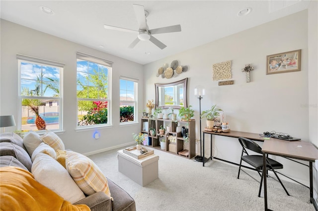 2511 Early Dawn Ct, Valrico, FL 33594 - living area featuring a ceiling fan, carpet floors, a healthy amount of sunlight, and baseboards