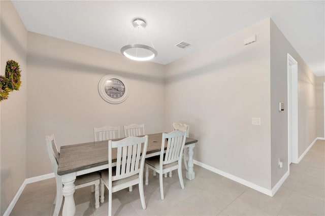 2511 Early Dawn Ct, Valrico, FL 33594 - dining area featuring light tile patterned flooring, visible vents, and baseboards