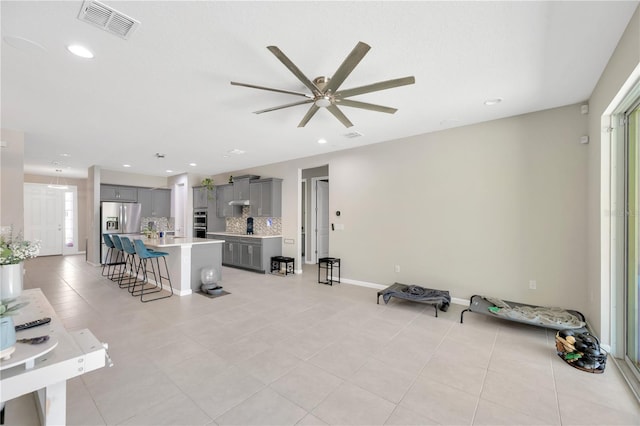 2511 Early Dawn Ct, Valrico, FL 33594 - unfurnished living room featuring baseboards, a ceiling fan, visible vents, and light tile patterned floors