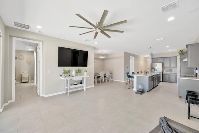 2511 Early Dawn Ct, Valrico, FL 33594 - living room featuring light tile patterned flooring, visible vents, baseboards, and ceiling fan