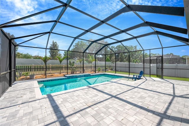 2511 Early Dawn Ct, Valrico, FL 33594 - view of swimming pool featuring a fenced backyard, a patio, a fenced in pool, and glass enclosure