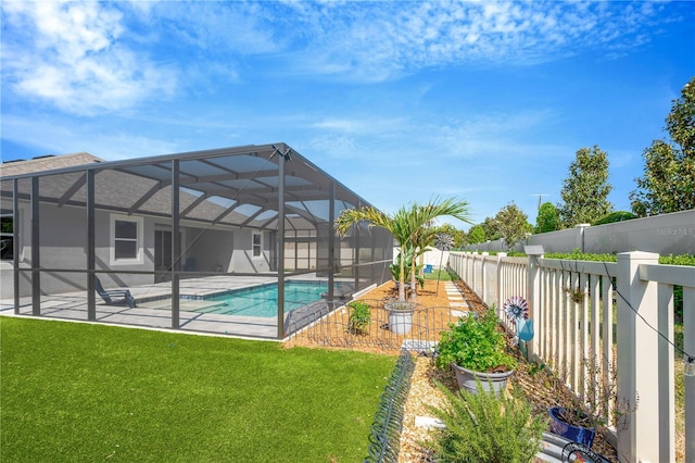 2511 Early Dawn Ct, Valrico, FL 33594 - view of swimming pool featuring glass enclosure, a fenced in pool, a fenced backyard, a lawn, and a patio