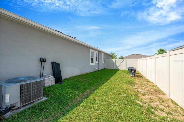 2511 Early Dawn Ct, Valrico, FL 33594 - view of yard featuring cooling unit and a fenced backyard