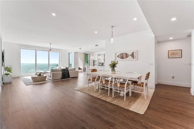 dining space featuring wood finished floors, baseboards, a ceiling fan, and recessed lighting