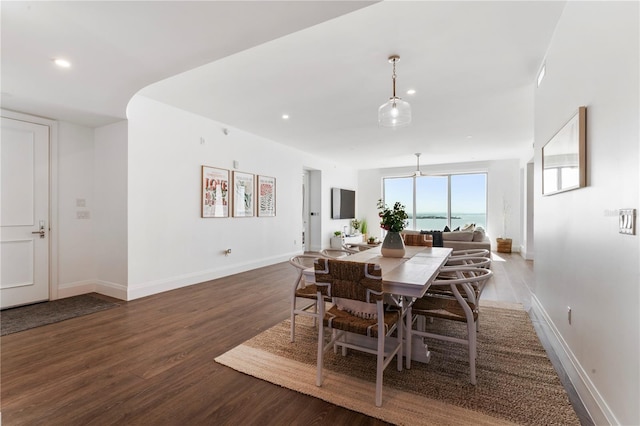 dining area with recessed lighting, baseboards, and wood finished floors