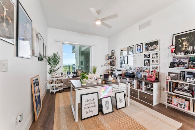 interior space featuring wood finished floors, a ceiling fan, and visible vents