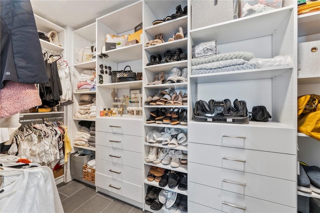 spacious closet featuring tile patterned flooring